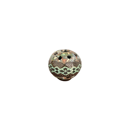 Front view of the spherical mosaic flower-frog vase with green diamond and dark floral pattern