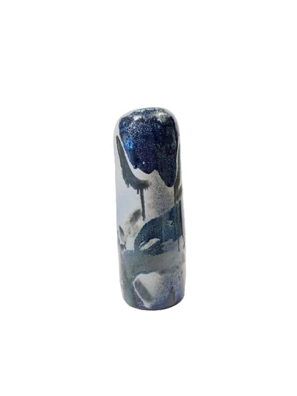 Tall glazed soda-fired pottery vase in shades of blue, charcoal and black. Uneven textural appearance and is one of a kind