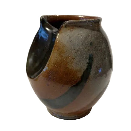 ceramic vase in shades of brown, rust, and charcoal. one of a kind with imperfections due to hand-made nature