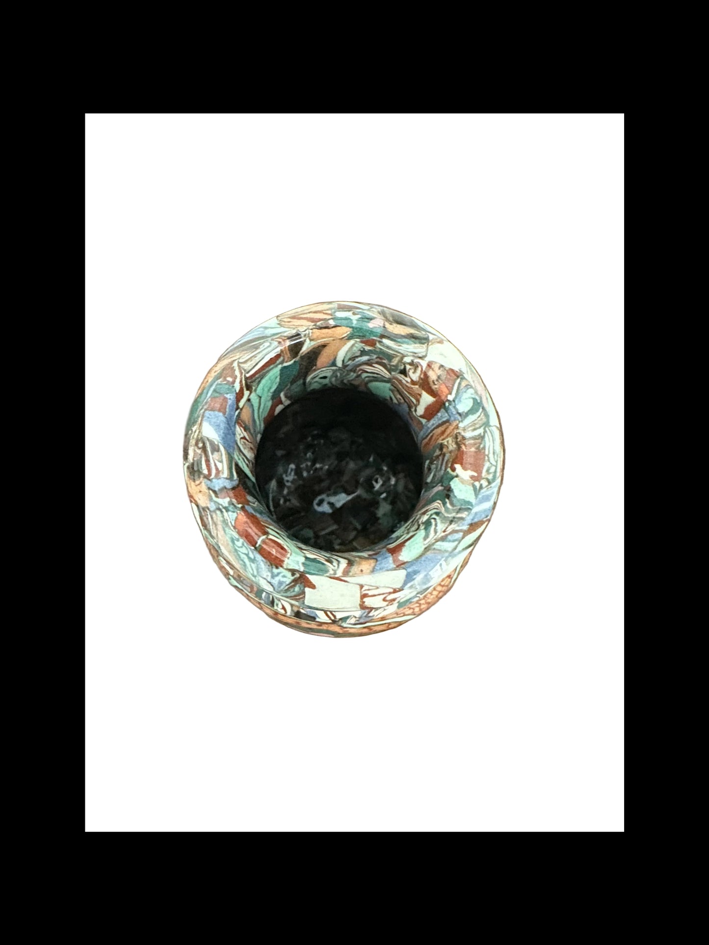 Top-down view into the narrow mouth of the Jean Gerbino mosaic vase