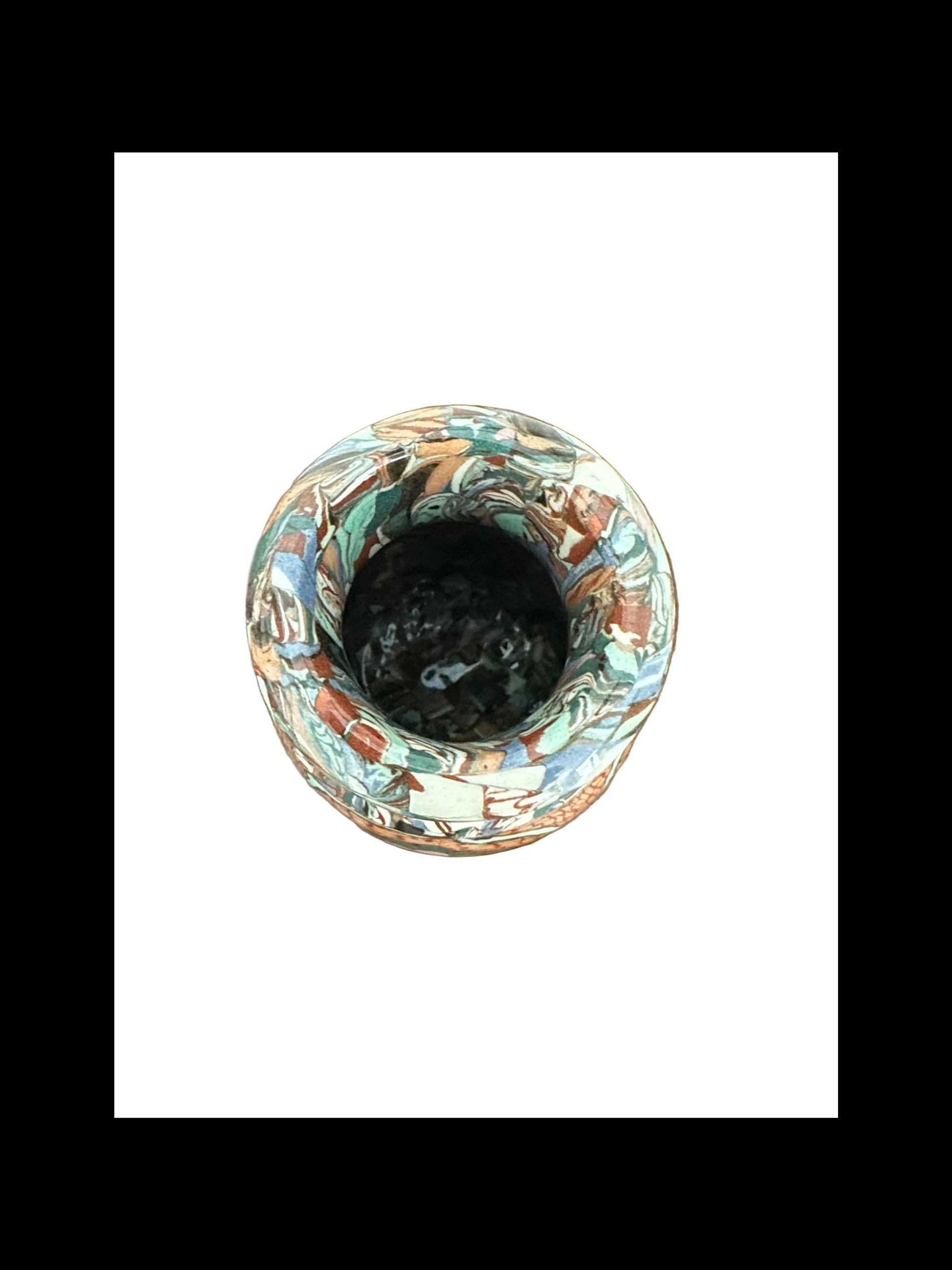 Top-down view into the narrow mouth of the Jean Gerbino mosaic vase