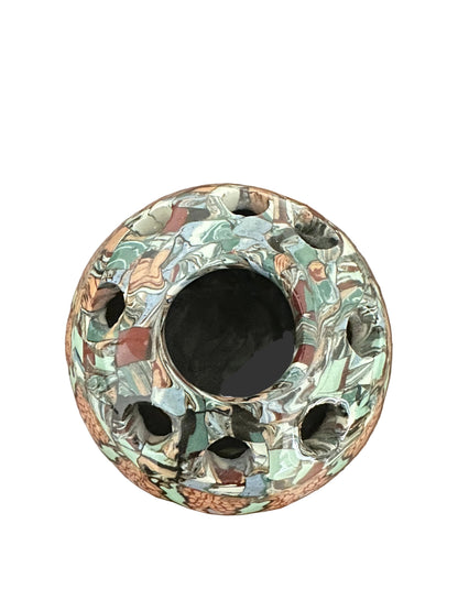 Top-down view of the mosaic flower-frog vase showing the central hole and surrounding smaller holes